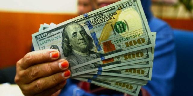 Rupiah Bergerak Melemah Menuju Rp 13.025 per USD