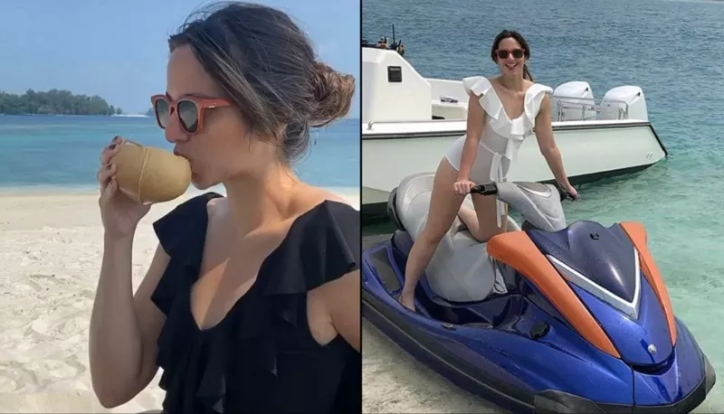 Gaya Nia Ramadhani Pakai Swimwear di Pantai, Centil Banget!