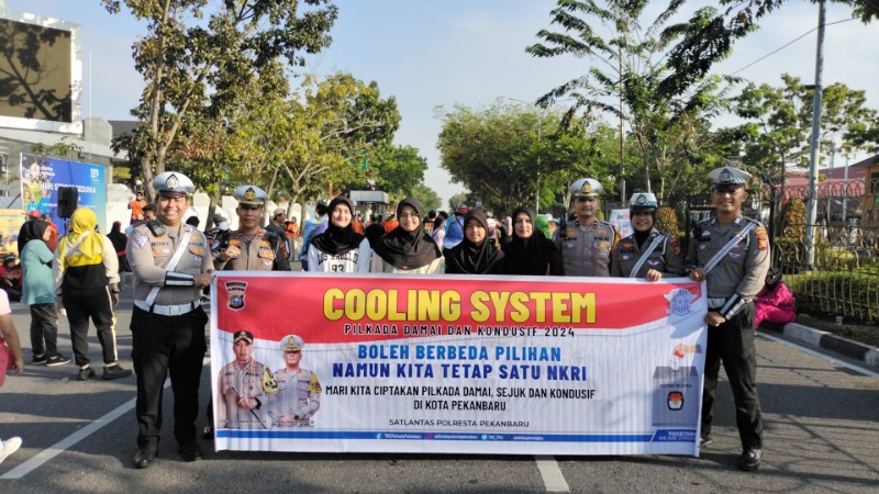 Satlantas Polresta Pekanbaru Gelar Pengamanan CFD dan Sosialisasi Pilkada Damai 2024