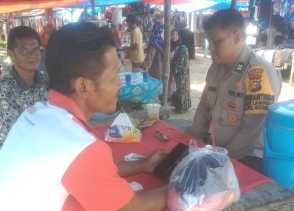 Aiptu Rudiel Jaga Keamanan Pasar, Sosialisasikan Pilkada Damai